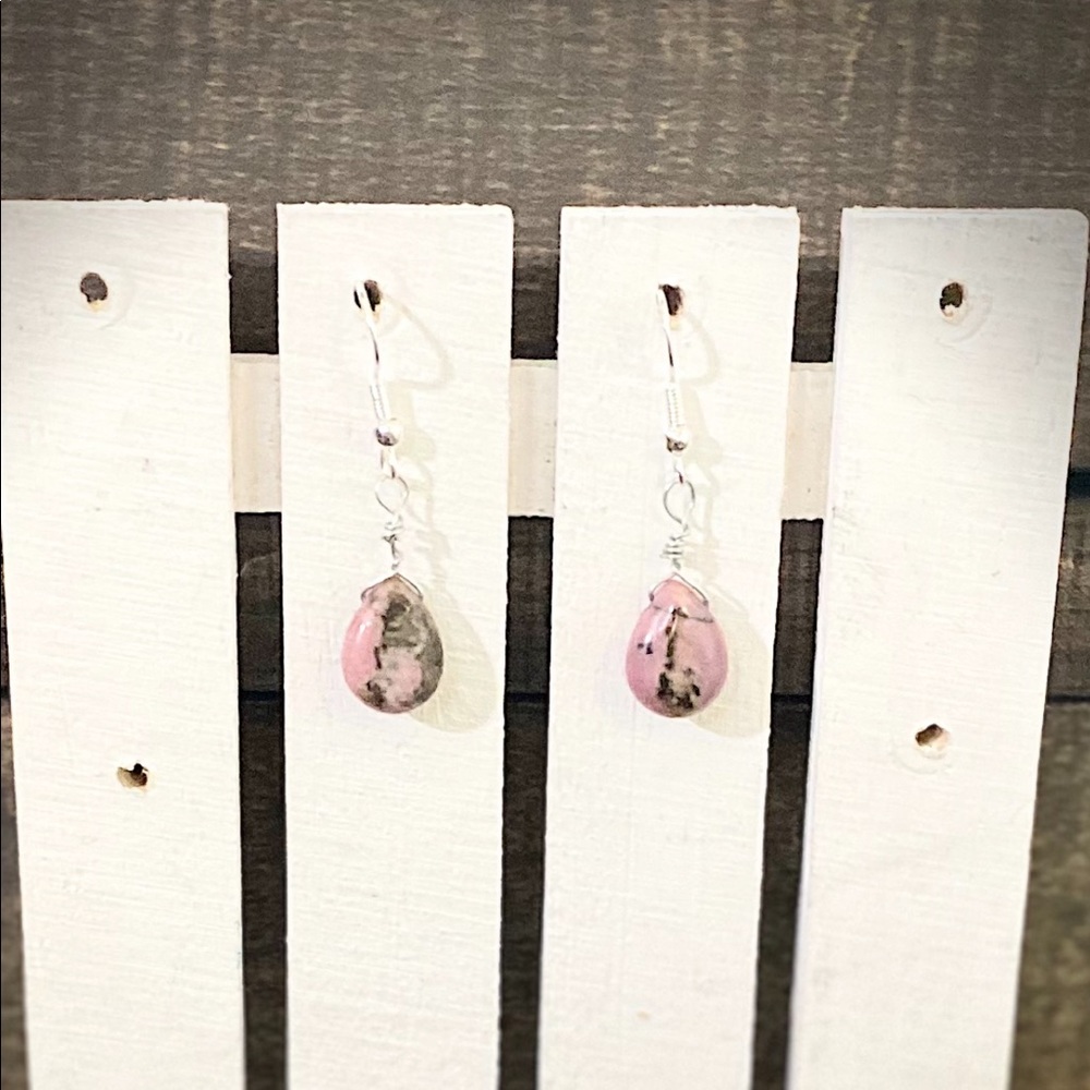 Rhodonite tear drop gemstone earrings with silver jewelry & the stone is 1/2 in.